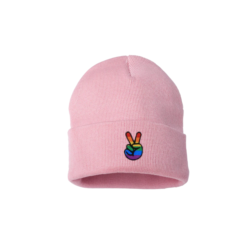 Baby pink cuffed beanie. It has an embroidered on the cuff with the Pride colors peace sign