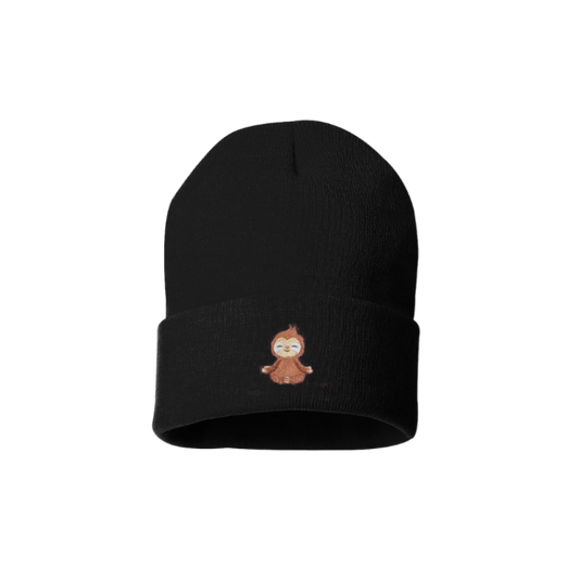 Black cuffed beanie with an embroidered sloth. The body is brown and the face creme and is meditating