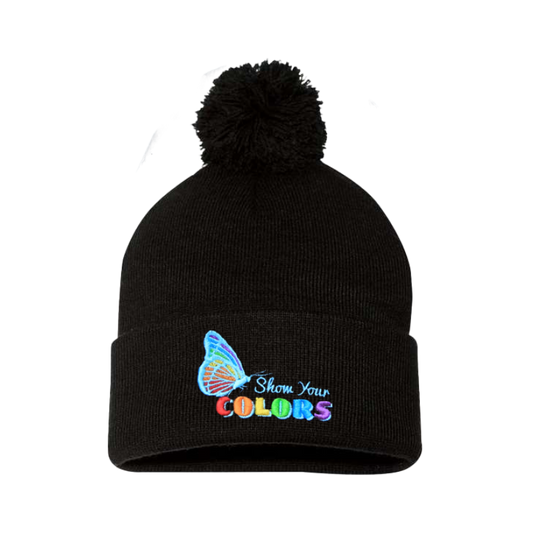 Black cuffed beanie with a pom pom. It has a butterfly embroidered with the LGTB colors and the logo show your colors on the cuff