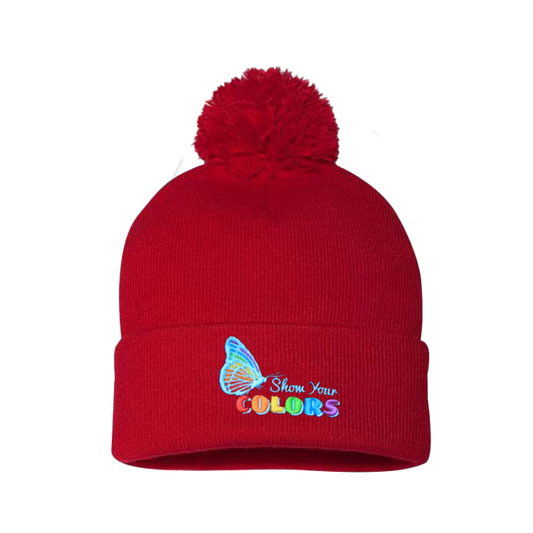 Red cuffed beanie with a pom pom. It has a butterfly embroidered with the LGTB colors and the logo show your colors on the cuff