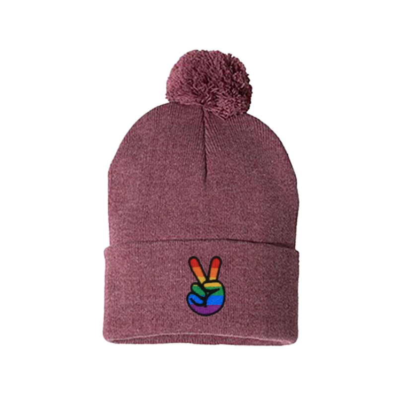 Heather cardinal cuffed beanie with a pom pom. It has embroidered the sign of peace on the cuff with the Pride colors